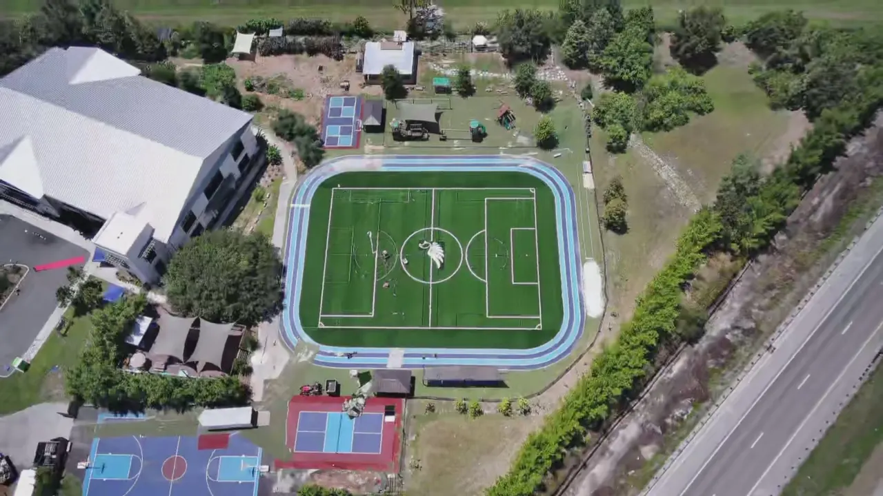 Aerial view of the Creation Village campus and athletic field